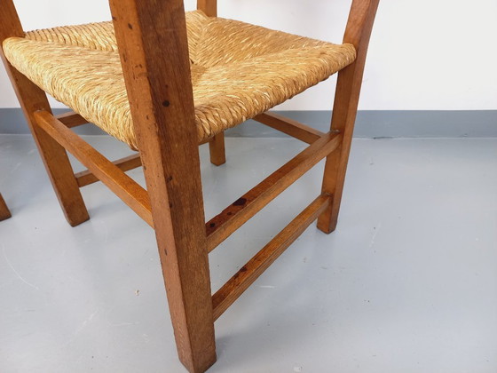 Image 1 of Suite van 2 vintage Brutalistische fauteuils in eiken en stro uit de jaren 60