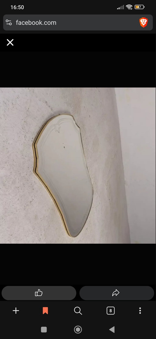 Antique-style wall mirror by Gio Ponti.