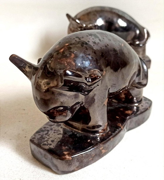 Image 1 of Een paar boekensteunen uit de jaren 60 met een gestileerd stierenontwerp.