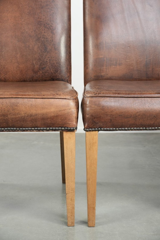 Image 1 of 4 x Vintage eetkamerstoel gemaakt van schapenleer met een hoge rug