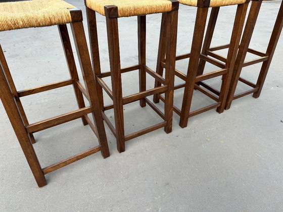 Image 1 of set van 4 houten barkrukken met rotan zitting