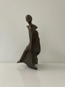 Expressive sculpture figure in the wind - futuristic