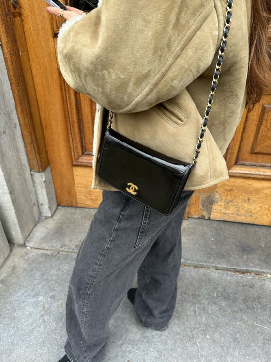 Image 1 of Portefeuille Chanel noir à chaîne