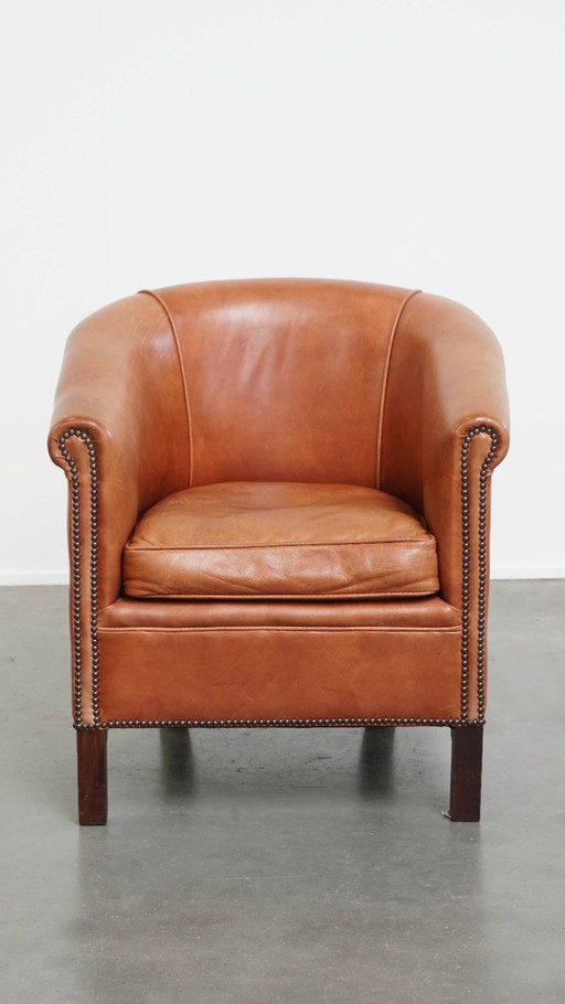 Beef leather English style club chair in a light cognac color