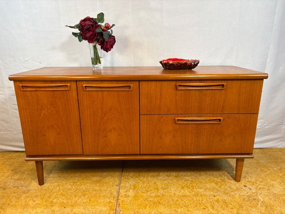 Image 1 of Mid-century retro vintage teak sideboard by Meredew 1960  This elegant teak sideboard by Meredew is a superb example of mid-cent