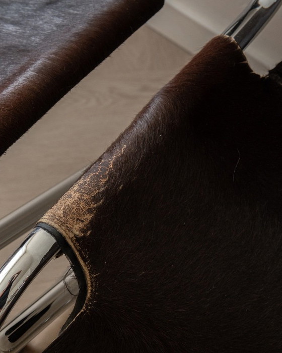 Sillas de comedor cantilever italianas de cromo y piel de vaca, años 70, juego de 4 – Leather (photo 18 of 18)