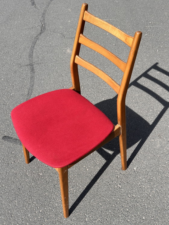 Image 1 of Casala designstoel – massief hout met rode bekleding – in uitstekende staat