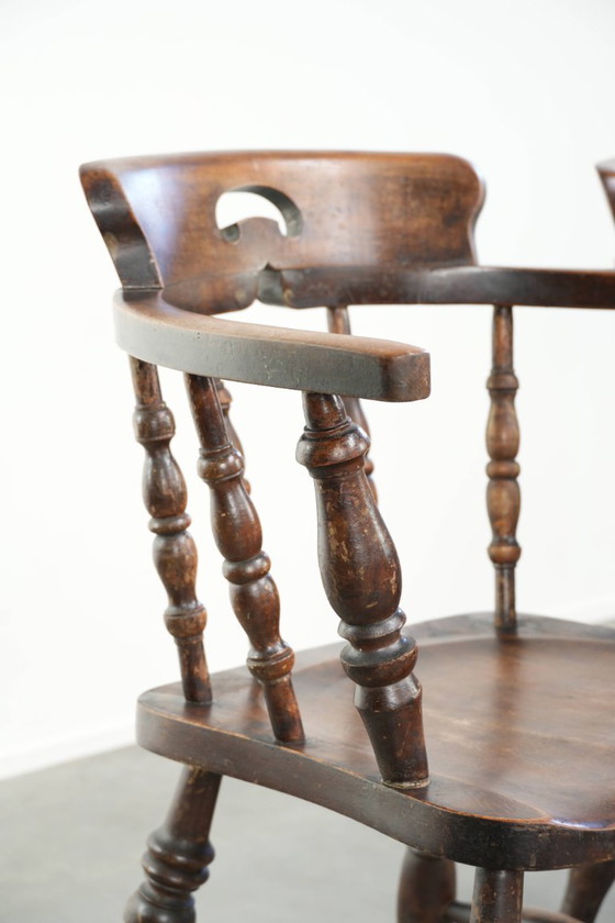 Image 1 of 2x antique English wooden pub/captain chairs from the late 19th century with character and a beautiful color scheme