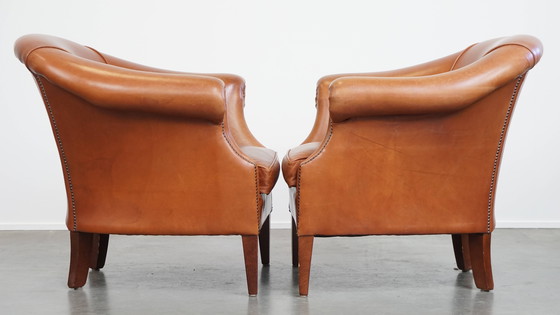 Image 1 of 2 x Cognacfarbener Rindsleder-Clubsessel mit dekorativem Nagelfinish