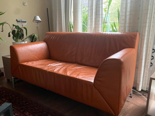 Jori two-three-seater design sofa with adjustable backrest in orange leather