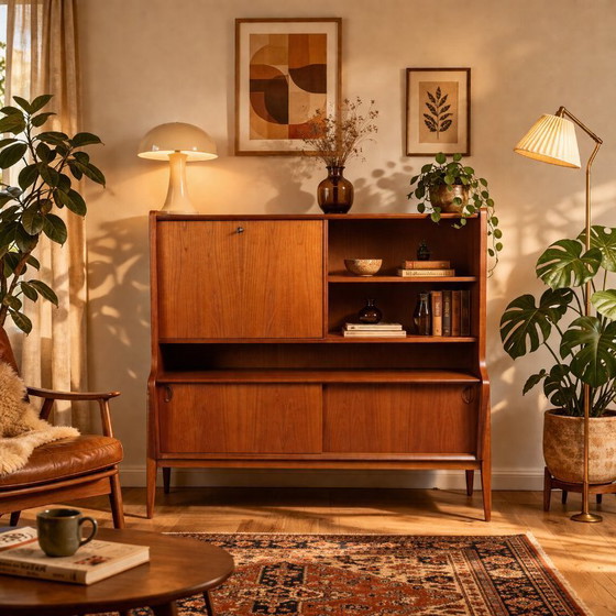 Image 1 of Teak-Highboard aus der Mitte des 20. Jahrhunderts von Oswald Vermaercke – Klappschrank mit originaler grüner Innenausstattung