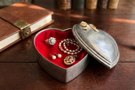 Heart-Shaped Metal Jewelry Box with Gold Bow and Red Velvet Interior