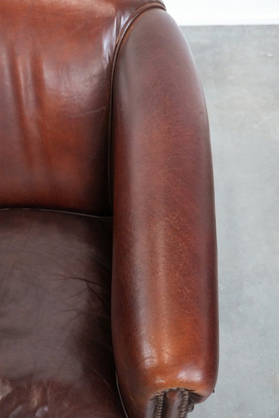 Image 1 of Vintage clubfauteuil gemaakt van schapenleer met siernagels