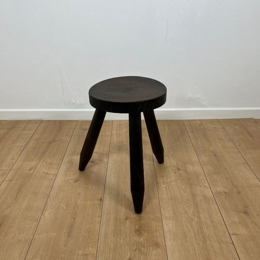Small brutalist tripod stool in solid wood