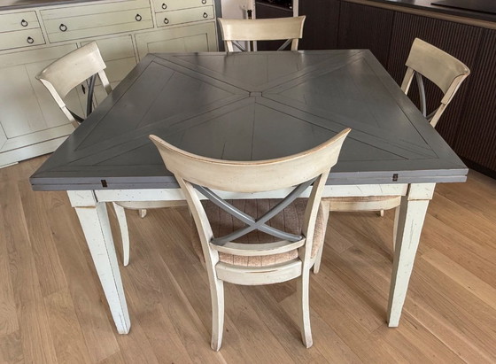Image 1 of Handkerchief table with 4 leaves and 4 chairs