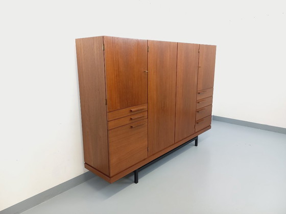Image 1 of Tall, modernist, vintage Scandinavian sideboard in teak and black metal from the 1960s