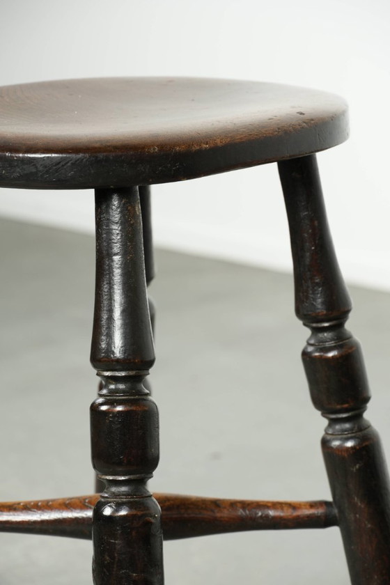 Image 1 of Antique English Windsor stool from the early 19th century with a unique oval shape