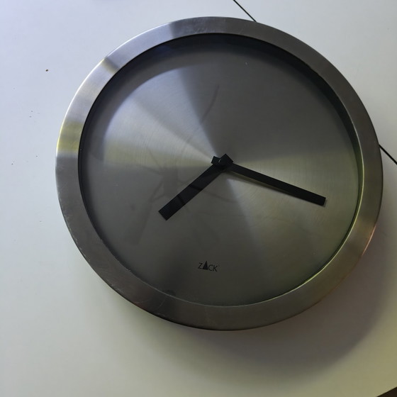 Image 1 of Minimalist wall clock by Zack in brushed stainless steel.