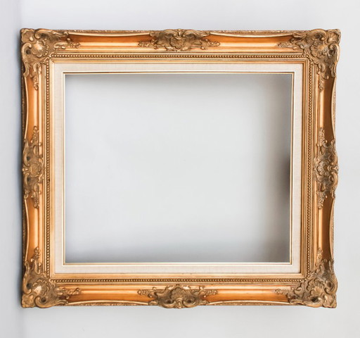 Antique Baroque wooden frame, patinated with gold leaf, handmade, Louis XVI style. Baroque frame for a painting, mirror, etc.