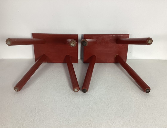 Image 1 of Two red vintage wooden stools side tables