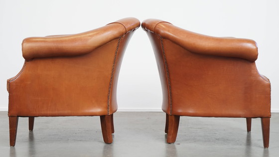 Image 1 of 2 x Cognacfarbener Rindsleder-Clubsessel mit dekorativem Nagelfinish