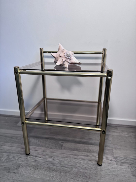 Vintage Regency stule  two-tier side table or nightstand featuring a brass-finished metal frame and smoked (photo 2 of 14)