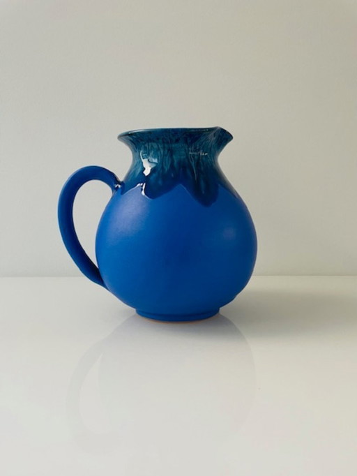 Cobalt blue ceramic jug with expressive glaze