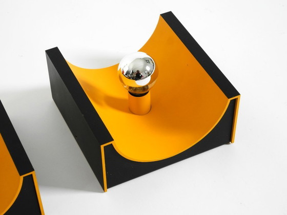 Image 1 of A rare pair of original 1960s Space Age metal wall lamps by Klaus Hempel for Kaiser Leuchten in yellow and black