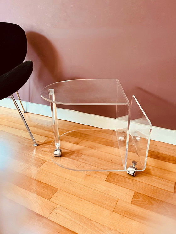 Image 1 of 80's Acrylic side table on wheels + reading material