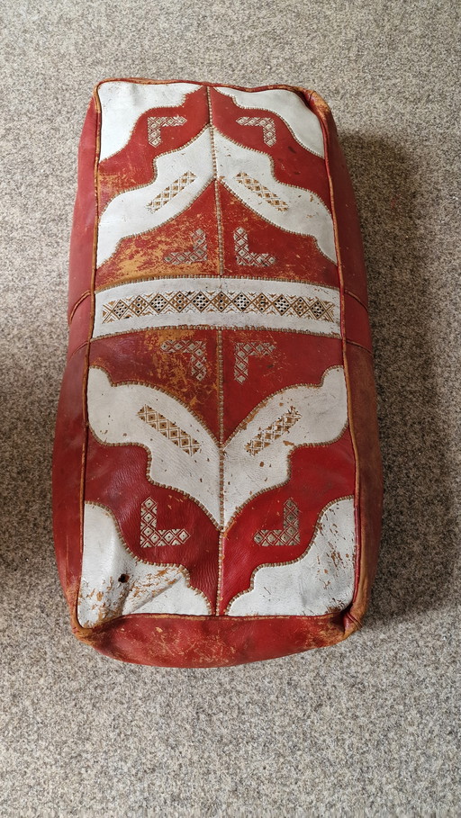 Oriental red/white leather pouf.