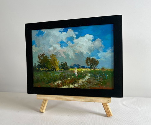 Origineel olieverfschilderij: Zomerlandschap: Een meisje loopt in een veld.