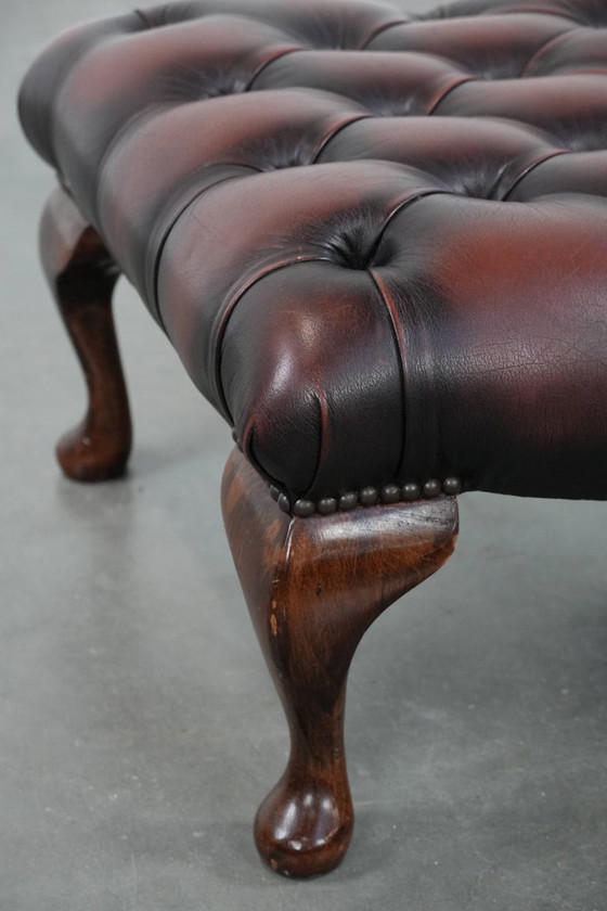 Image 1 of Dark brown Chesterfield footstool made of cowhide
