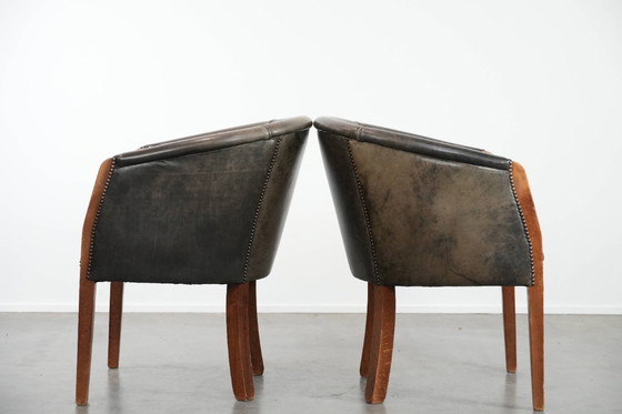 Image 1 of 2 sedie a vasca in pelle di mucca e legno con una bella e robusta combinazione di colori