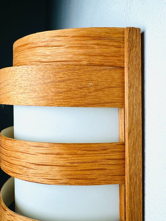 Image 1 of Elegant mid-century wall lamp crafted from curved pine veneer, produced in Sweden during the 1960s.