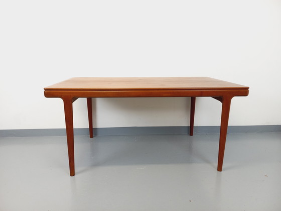 Image 1 of Scandinavian rectangular vintage dining table by Johannes Andersen for Samcom from the 60s in teak with integrated extensions