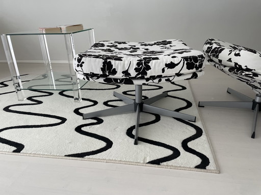 Black and white floral armchair with footstool