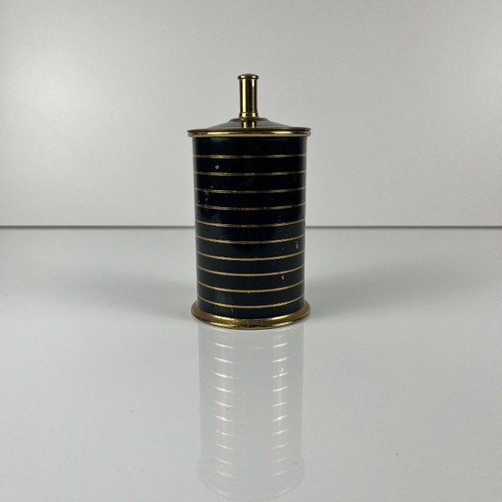 Image 1 of Sigarettendispenser/houder van zwart en goudkleurig metaal, jaren 60/70.