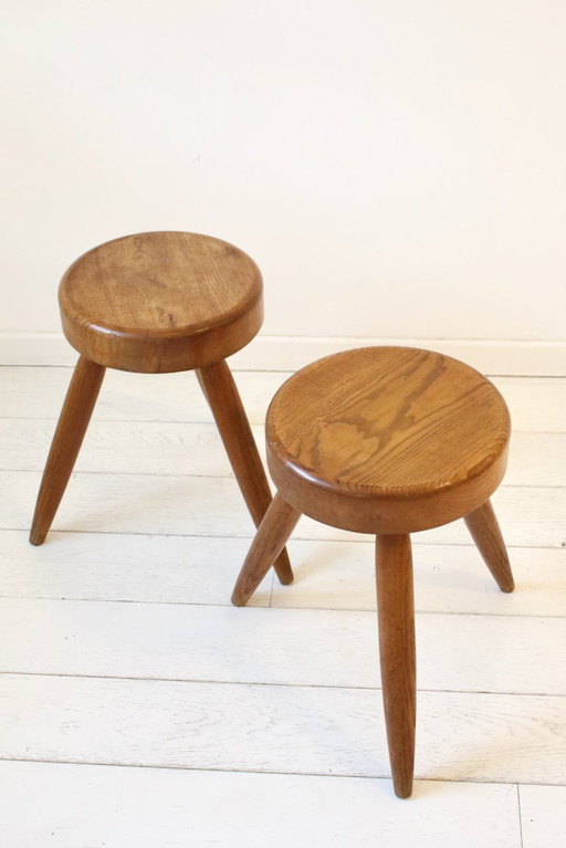 Pair of Perriand-style tripod stools.