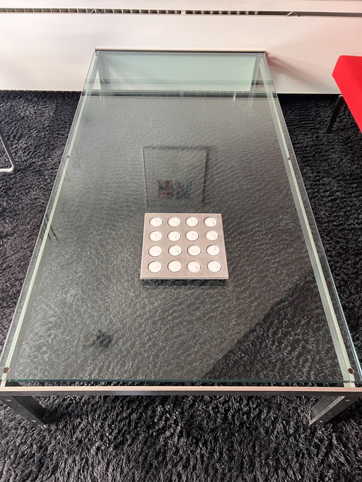 Glazen salontafel met metalen onderstel