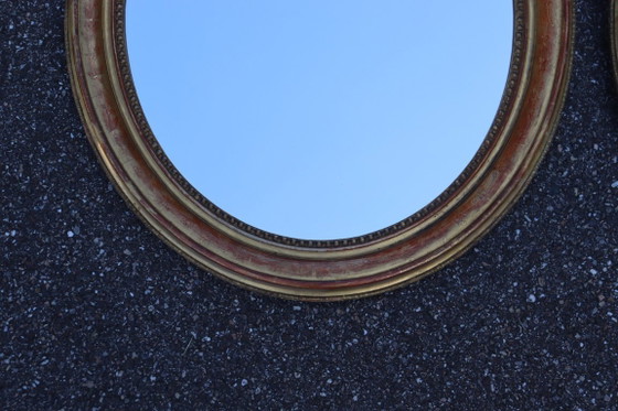 Image 1 of Pair of oval Louis Philippe period mirrors in giltwood