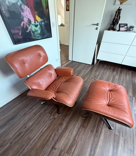 Poltrona Eames Lounge Chair & Ottoman Orig. del 1976, Legno di Palissandro, Prof. Restaurata – Herman Miller (photo 7 of 13)