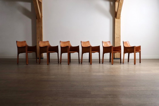 Image 1 of 6er-Set Cassina CAB Esszimmerstühle mit Armlehnen in cognacfarbenem Leder von Mario Bellini, Italien, 1970er Jahre
