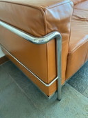 Leather three-seater sofa with ambassador