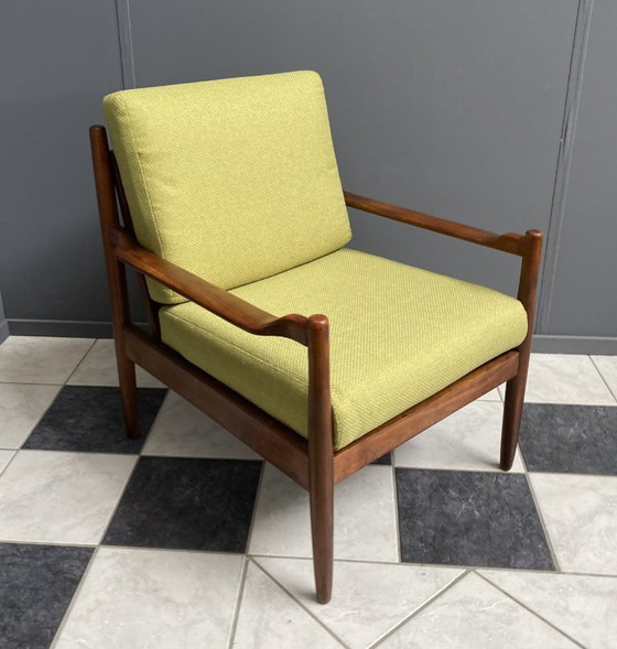 Image 1 of Gele stoffen en houten relaxstoel uit de jaren 60.