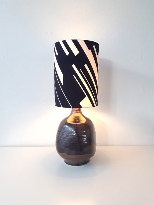 Sturdy dark brown ceramic Rheinfelden lamp base with new handmade lampshade of black and white graphic fabric