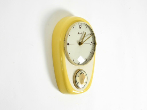 Beautiful battery-operated Mid-Century Modern wall clock by Mauthe with a glazed ceramic case