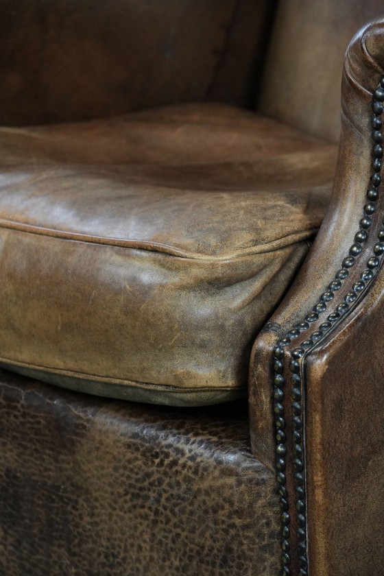 Image 1 of Comfortable vintage sheepskin wing chair with character