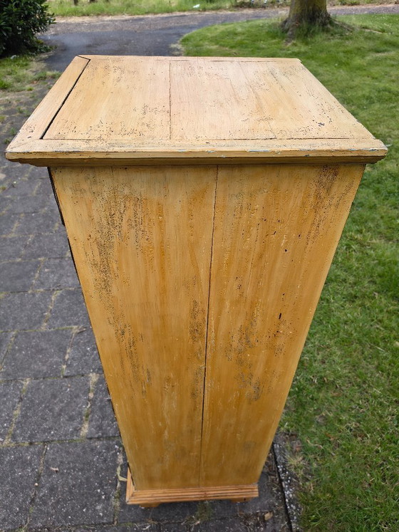 Image 1 of Vintage ochre yellow chest of drawers / apothecary