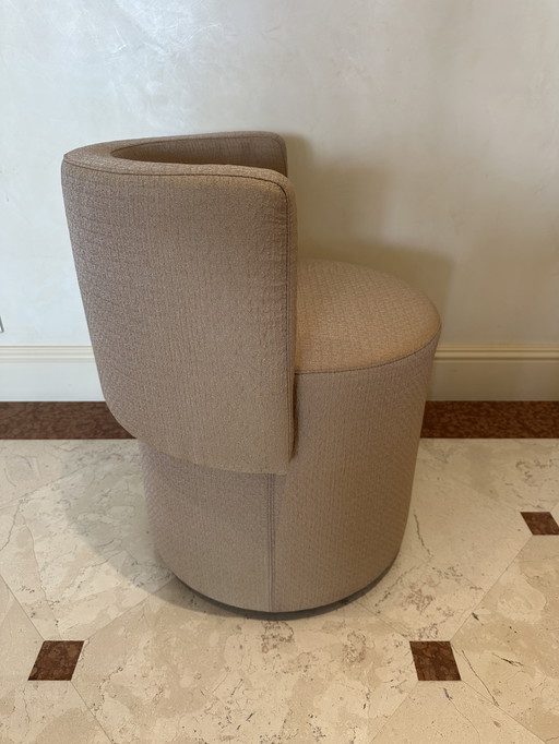 Small round upholstered armchair 