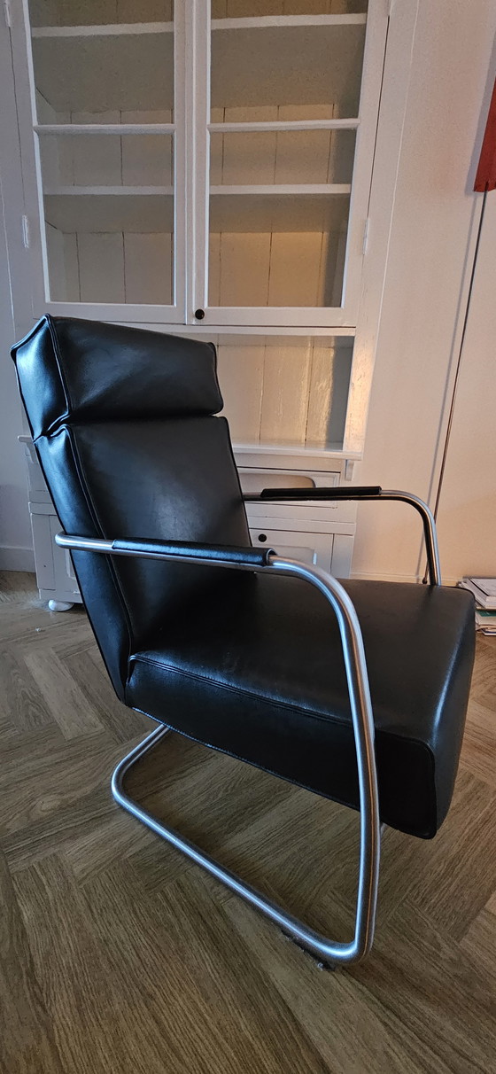 Image 1 of Schwarzer Ledersessel mit Fußhocker